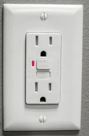 Protruding RESET Button on a GFCI Outlet